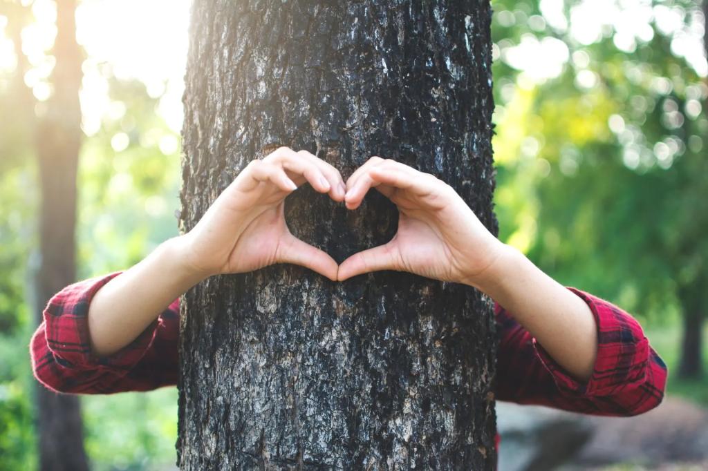A person hugged a tree and making a heart sign with there hands